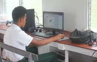 Linford Marks, the Hub Technician in training, practicing his program skills at the computer hub.