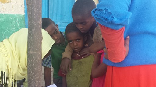 Children receive their trachoma prophylaxis medications at the annual trachoma campaign.
