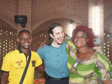 three persons smiling