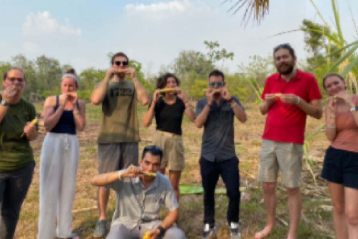 volunteers eating sugar cane