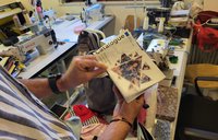 A non-profit director in Kosovo shows his organization's catalogue.
