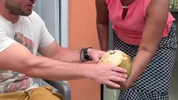 Host Mom Cuts Coconuts for Volunteers in the Dominican Republic