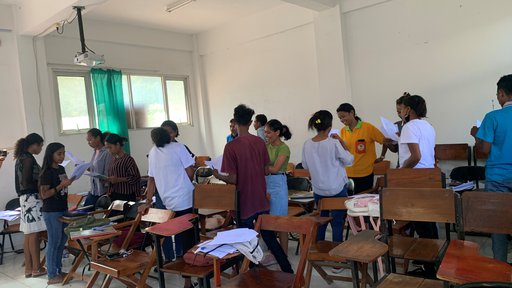 Students standing up doing group work