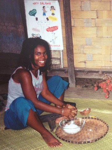 James collecting coconut flesh for a meal.