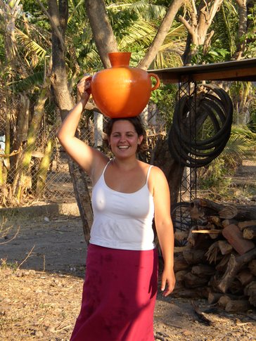 Every morning, Bri carried water on her head in a plastic "cantaro." It took 23 trips to her neighbor's house to fill a large cement basin where she would wash dishes and bathe and store water to be used for household chores.