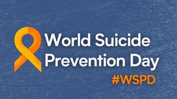 A blue graphic with an orange ribbon. The text reads World Suicide Prevention Day with the hashtag #WSPD.