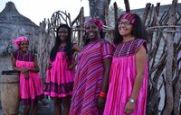 Clarice with her Namibian mother and sisters at their house.