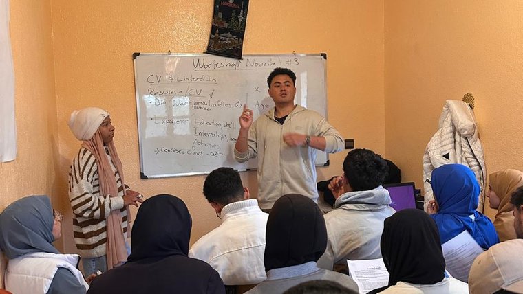 A man gives a presentation in front of a group