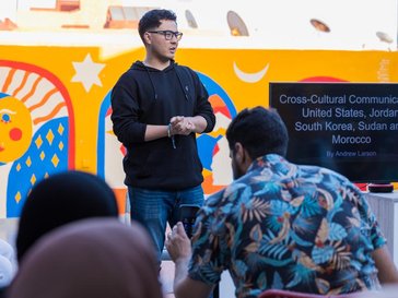 A man gives a presentation in front of a group