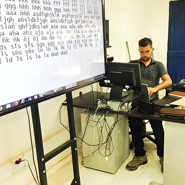 Students do typing exercises in a school computer lab during an after-school tech club Curt hosted.