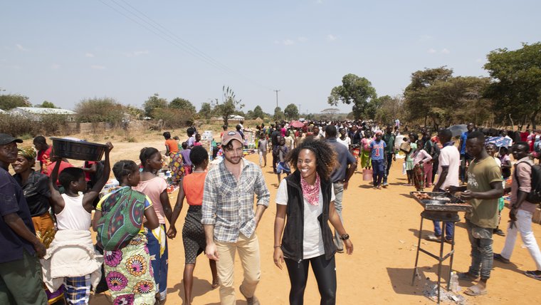 Emily Kroloff walks with community members in Zambia