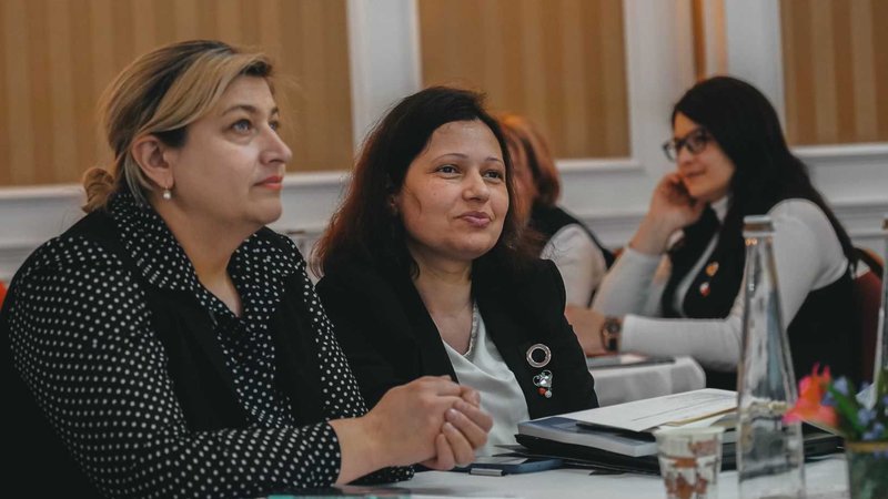 Teachers listen to a session in Moldova