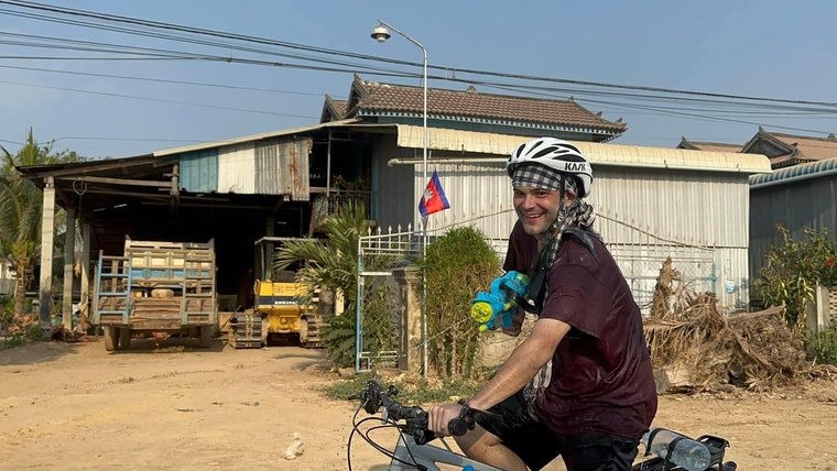 Reagan rides his bike on Khmer New Year in Cambodia.