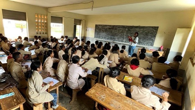 Volunteer Hewan teaches English to high school students in Madagascar.