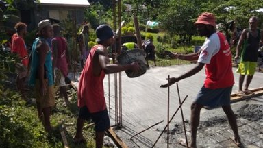 Community members proving man power for the building project