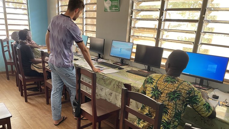 Dalton and the youth center team lead a train-the-trainer workshop on digital literacy.