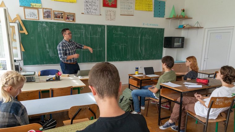 Volunteer Ossian supports a debate club at a Montenegrin school.