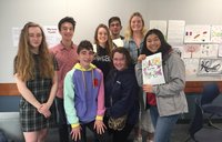 Students in California with books they wrote for children in Cameroon