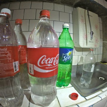 Our bottles of purified drinking water and the water filter, top right.
