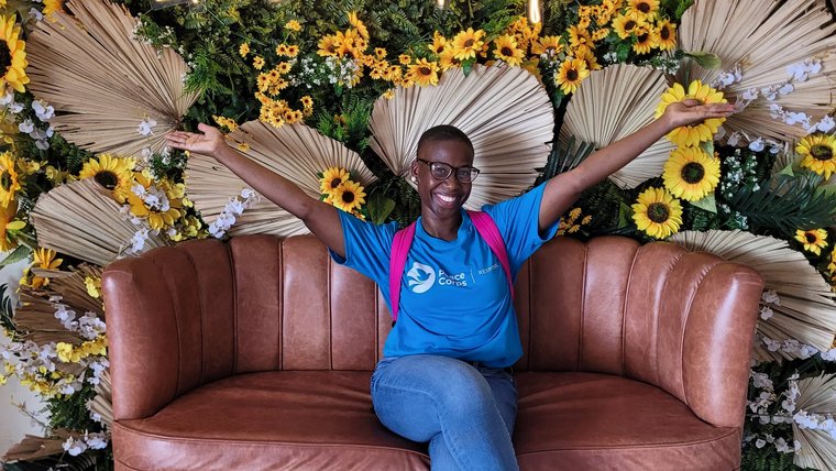 Volunteer Chanel Rigby sits on a chair