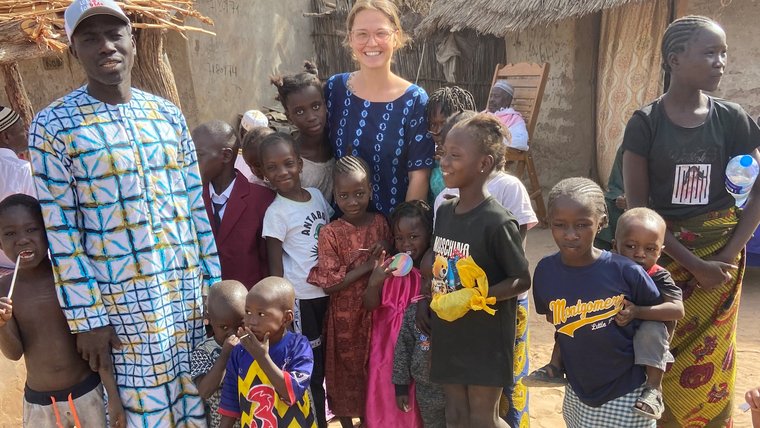 McKenna and her host family in The Gambia.
