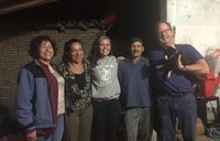 A PCV in Paraguay stand with both her biological parents and her host parents.