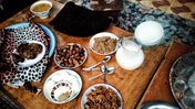 dates, hardboiled eggs and other snacks on a table