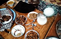 dates, hardboiled eggs and other snacks on a table