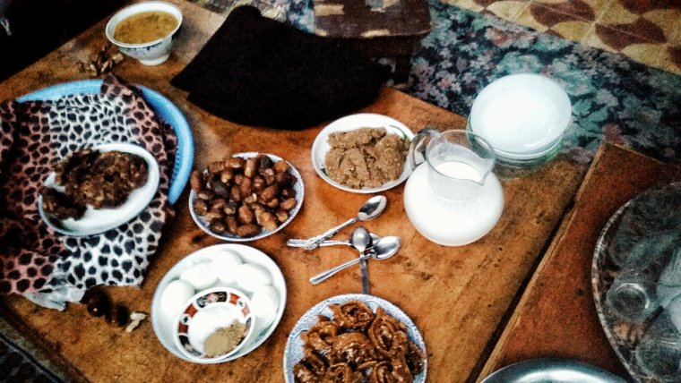 dates, hardboiled eggs and other snacks on a table