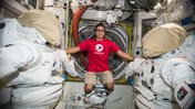 Astronaut Joe Acaba wears a Peace Corps T-shirt on the International Space Station