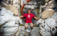 Astronaut Joe Acaba wears a Peace Corps T-shirt on the International Space Station