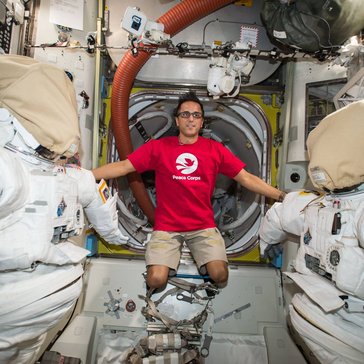 Astronaut Joe Acaba wears a Peace Corps T-shirt on the International Space Station