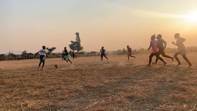 An all-girls neighborhood soccer game—a game usually played by men—in Zambia.