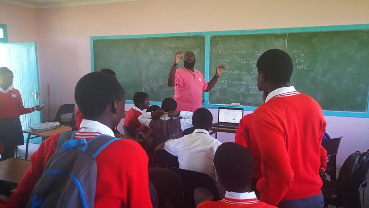 Kirby with his students.jpg