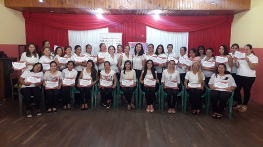 Women with their certificates