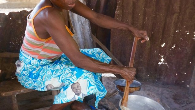 Kotoko mixes corn flower into water to make akpa to sell at the local high school and ultimately support her family.  Income 