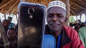 man with phone benin