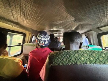The interior of a crowded matatu in Kenya.