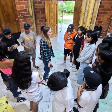 Molly leads a life skills training with youth in the local library