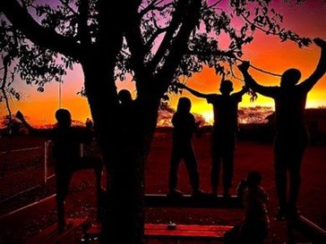 A silhouette photo helps Namibian students learn about the sun's movement.