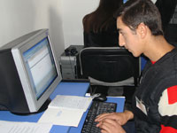 Photo of student Vahe Kolokyan, taken at the Computer Lab during the opening ceremony.