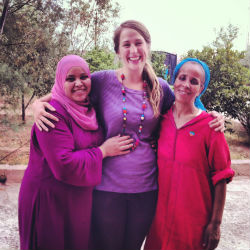 Recently returned volunteer Sarah Quinn with female artisans in Morocco.