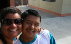 Peace Corps volunteer Ana De la Rosa with a student in her Peruvian community.