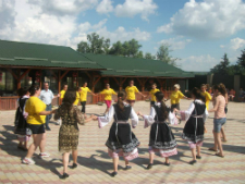 Volunteers participate in a traditional Moldovan dance