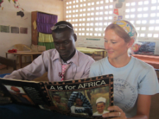 Szuwalski reads with one of the teachers
