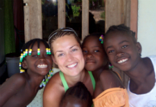 Peace Corps volunteer Kate Sullivan with children in her community