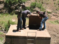 Peace Corps volunteer Phil Youngren (right) working with local community members on a new water infrastructure project in Lesotho.