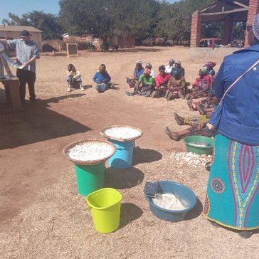 David conducts nutrition trainings with local agriculture extension officers in a Malawian village.