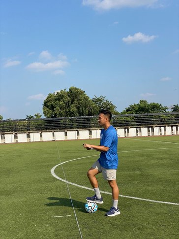 Simon acting as a match commissioner for a primary school football (soccer) game in Belize.