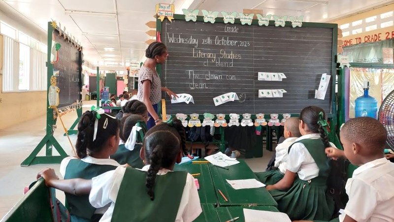 A teacher leads a classroom in Guyana